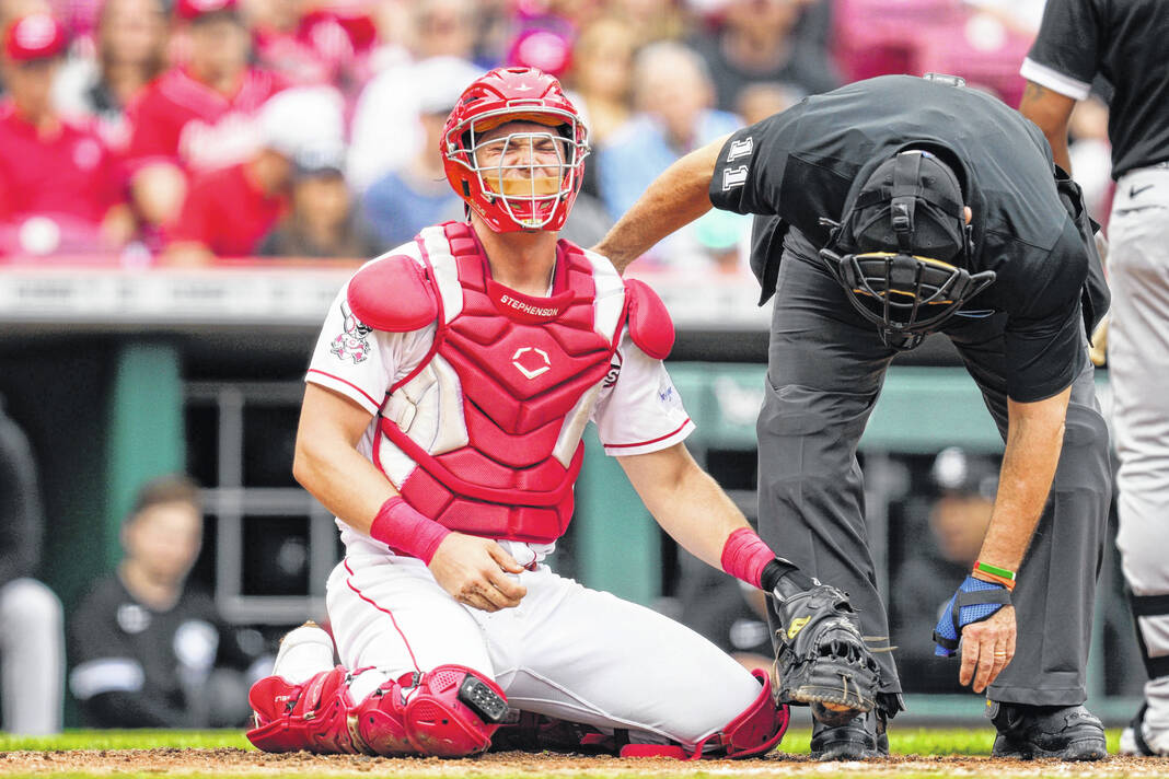 Jonathan India of the Cincinnati Reds reacts after being hit by a