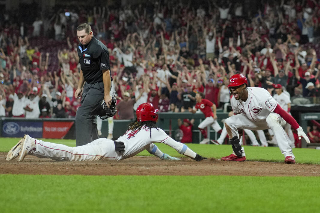 Ty France of the Seattle Mariners celebrates scoring a run with